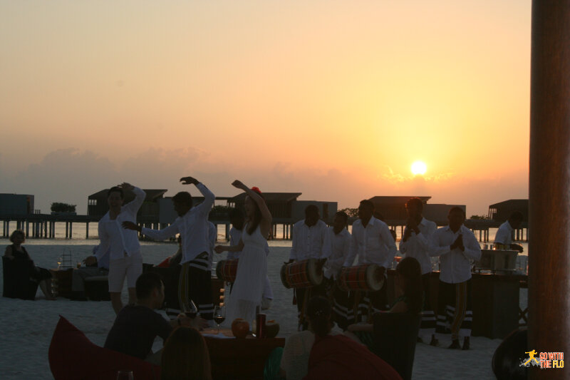 Local group of Maldivians playing the drums and singing (the woman is a fellow tourist)