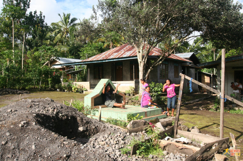 Catholic grave in a front-yard