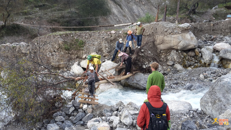 Crossing a bridge on the way to the big waterfall