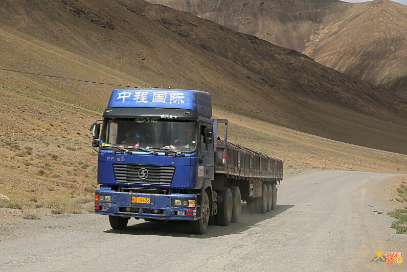 Soon after we started passing about a dozen Chinese trucks